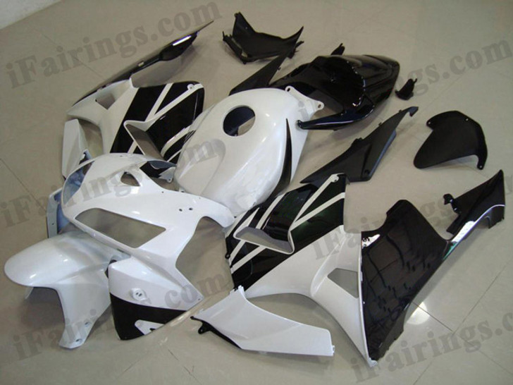 Honda CBR600RR 2005 2006 white and black fairing kits, this Honda CBR600RR 2005 2006 plastics was applied in white and black graphics, this 2005 2006 CBR600RR fairing set comes with the both color and decals shown as the photo.If you want to do custom fairings for CBR600RR 2005 2006,our talented airbrusher will custom it for you.