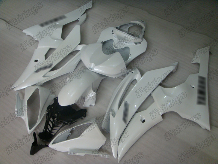 Aftermarket fairing for 2008 to 2016 Yamaha YZF-R6 pearl white with black stickers.