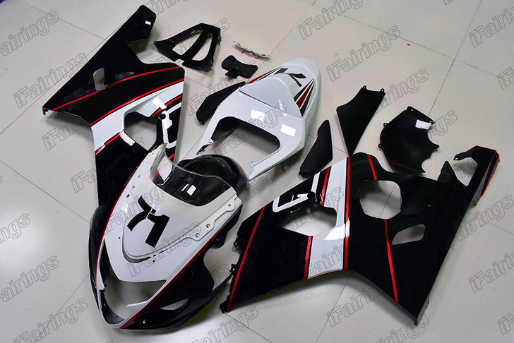 Aftermarket fairing for 2004 2005 Suzuki GSXR 600/750 white and black color with red stripes.
