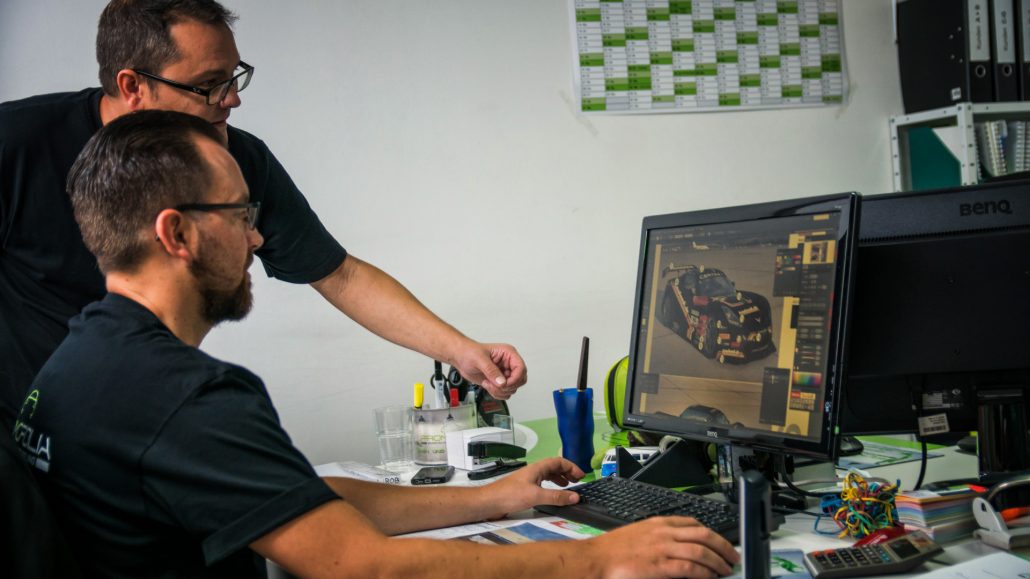 Promofolia team members designing vehicle and motorsport graphics
