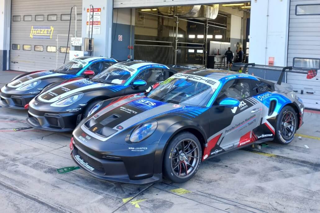 Three Porsche race cars prepared for professional motorsport