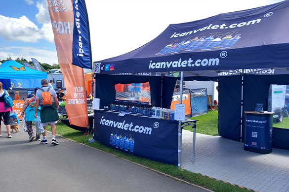 Branded pop-up gazebo with full canopy print at outdoor trade show