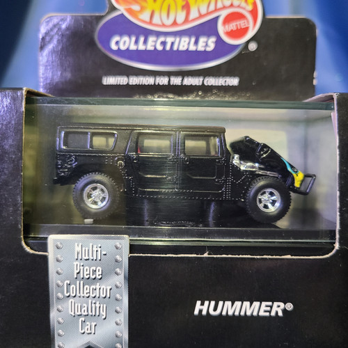 Hot Wheels Collectibles Hummer SUV with Case (Black w/flames) by Mattel.