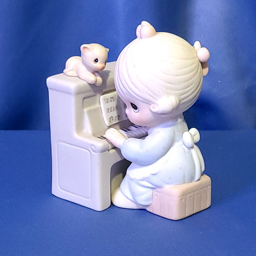 Precious Moments "Lord, Keep My Life in Tune" Figurine by Enesco.