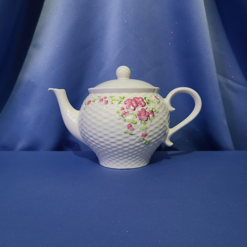 A Pink Floral Basket Weave Teapot by Teleflora Inc.