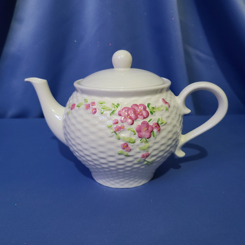 A Pink Floral Basket Weave Teapot by Teleflora Inc.