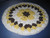 Round African Flower Potholder-Trivet in Yellow and Brown Crocheted by Mumsie of Stratford.