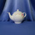 A Pink Floral Basket Weave Teapot by Teleflora Inc.