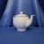 A Pink Floral Basket Weave Teapot by Teleflora Inc.