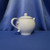 A Pink Floral Basket Weave Teapot by Teleflora Inc.