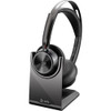 Poly Voyager Focus 2 MS Bluetooth Headset on Charging Stand