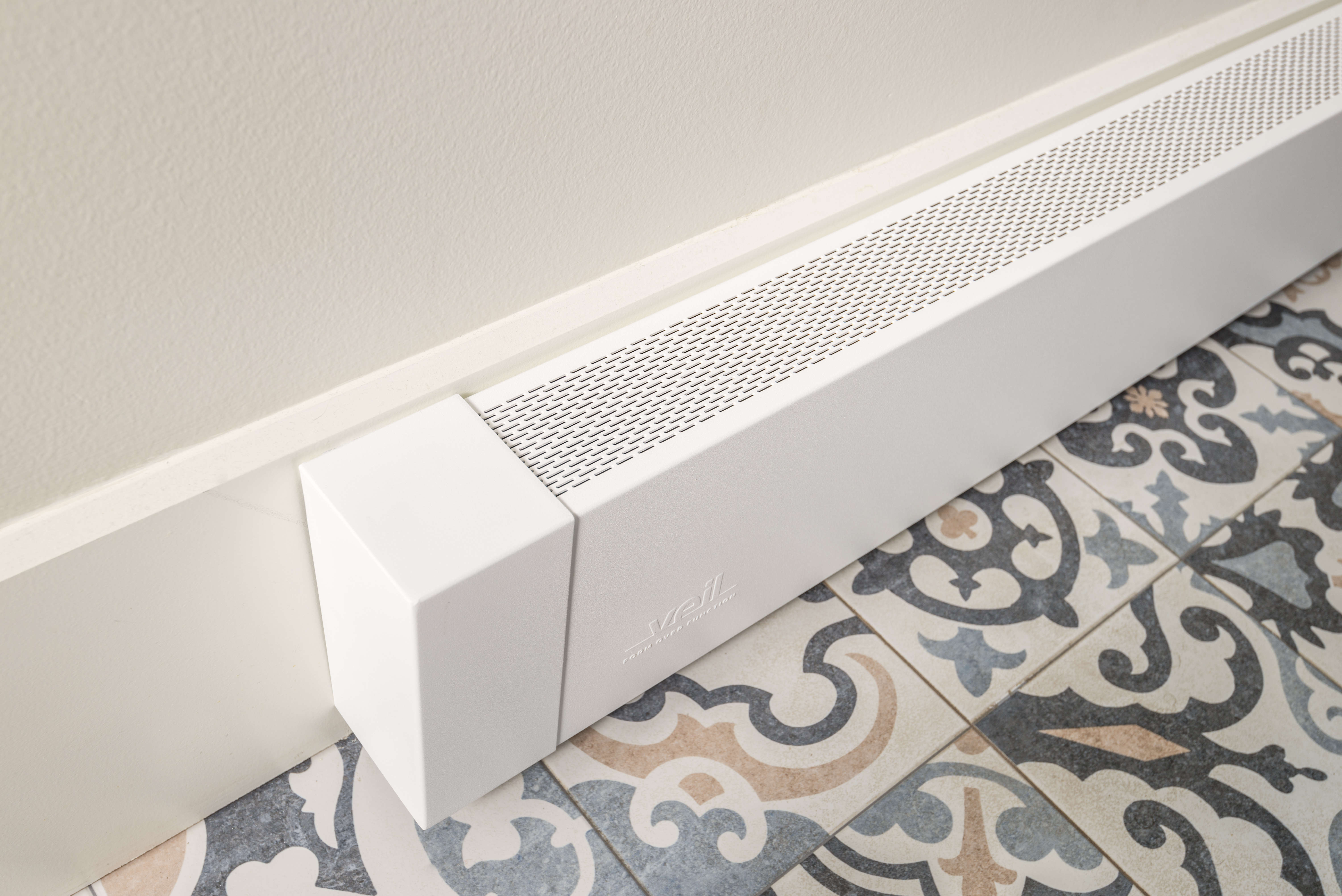 Atlas modern baseboard cover closeup on decorative tile floor