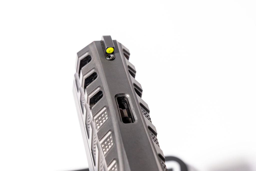 Looking down the top of the Torch Tactical slide from the muzzle, showing the vertical port openings.