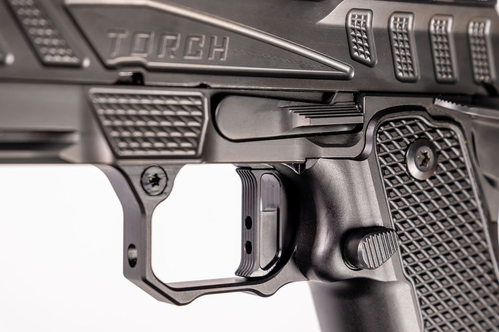 Miller Trigger and the trigger adjustment port through the frame.