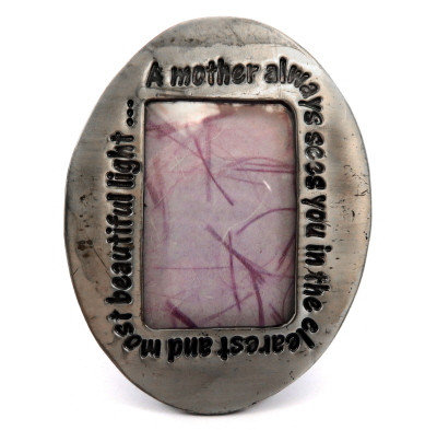 Small oval shaped picture frame with the words "A mother always sees you in the clearest and most beautiful light..." engraved around the oval pf60