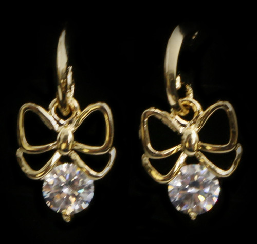 Gold tone cubic zirconia dangle earrings with a metal bow hanging from a crescent shaped hook and the stone attached to the bottom of the bow CZ05