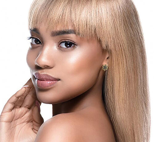 Gold tone cubic zirconia stud earrings with the stone topping a metal snowflake design CZ07