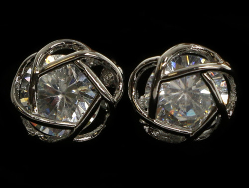 Silver tone cubic zirconia stud earrings with a large stone topped with a metal design CZ12A