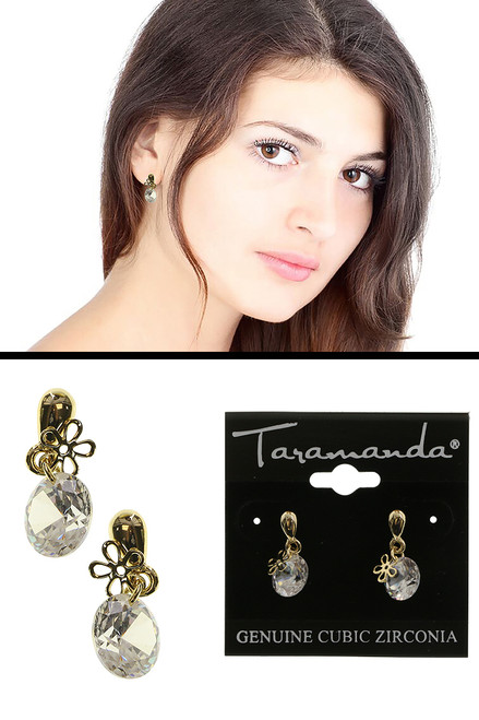 Gold tone cubic zirconia dangle earrings with one large stone and a small delicate flower charm CZ19