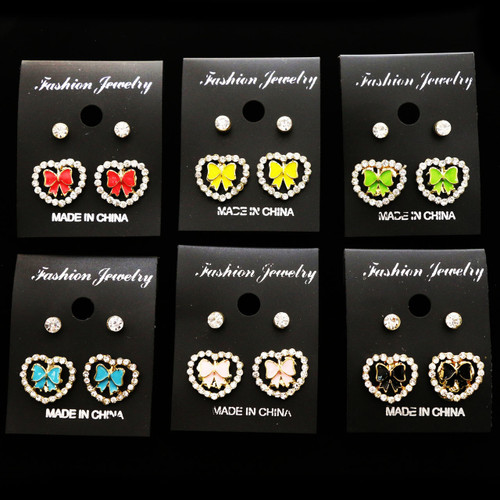 Two pack of gold tone heart and diamond like stud earrings ME288C