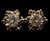 Gold tone cubic zirconia stud earrings with the stone topping a metal snowflake design CZ07