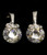 Silver tone cubic zirconia dangle earrings with cuff shaped post and small bow at the end of the cuff topping the stone CZ11A