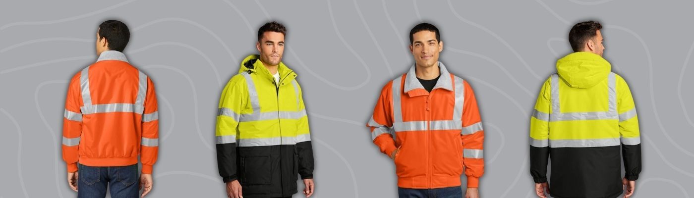 Models wearing custom high-visibility safety jackets in orange and yellow with reflective striping from Port Authority, designed for construction, logistics, and outdoor teams.