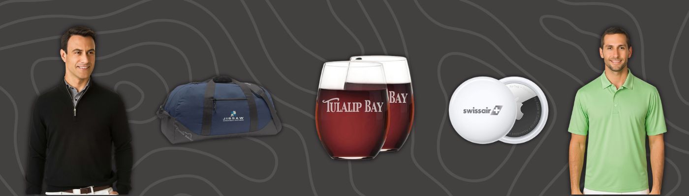 Custom polos, duffel bags, stemless glasses, and smart trackers were displayed as holiday gifts for employees.
