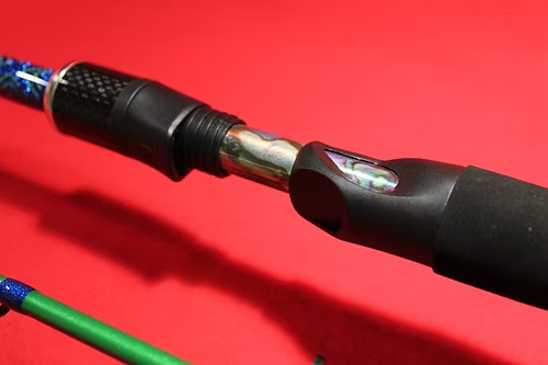 A custom, handcrafted, painted bass spinning rod.