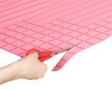 Picture showing you how to trim your BaseLayer Cut-to-Fit Cargo Mat Special Pink Edition to your car, truck, or SUV.