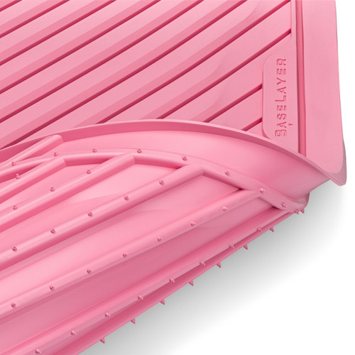 View of the underside of the BaseLayer Cut-to-Fit Cargo Mat Special Pink Edition.