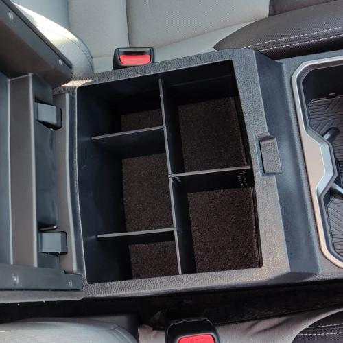 Vehicle OCD by BaseLayer center console organizer for the Tacoma 2024+ installed.