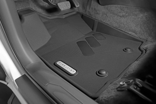 BaseLayer Custom-Fit All-Weather Floor Liners for the Toyota Tacoma 2016 - 2023 Access Cab and Double Cab. Driver side with gray logo.