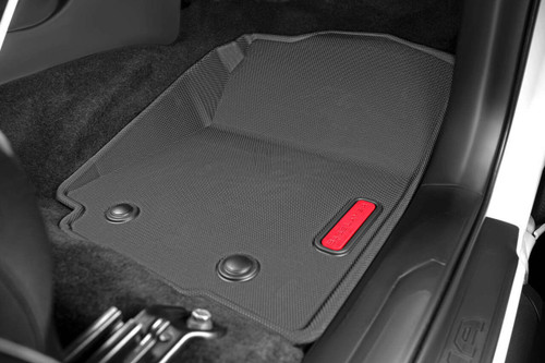 BaseLayer Custom-Fit All-Weather Floor Liners for the Toyota Tacoma 2016 - 2023 Access Cab and Double Cab. Front passenger side with red logo.