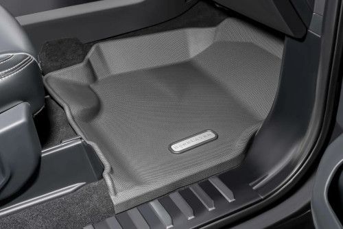 BaseLayer Custom-Fit F-250 / F-350 Front Floor Liners passenger side installed in truck with gray logo