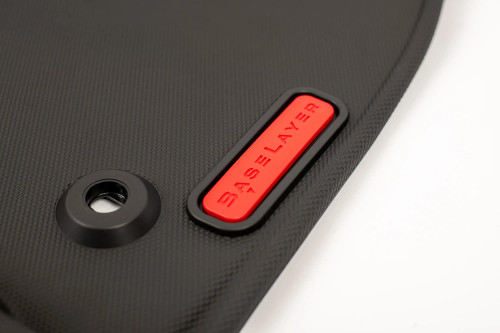 Close-up of the passenger side BaseLayer custom-fit floor liner for the 2024+ Toyota Tacoma with red logo