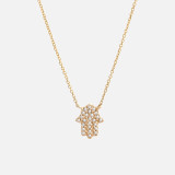 Solid 14k gold diamond hamsa hand necklace. Delicate cable chain with single-prong pave diamond pendant. Sparkles in the light.