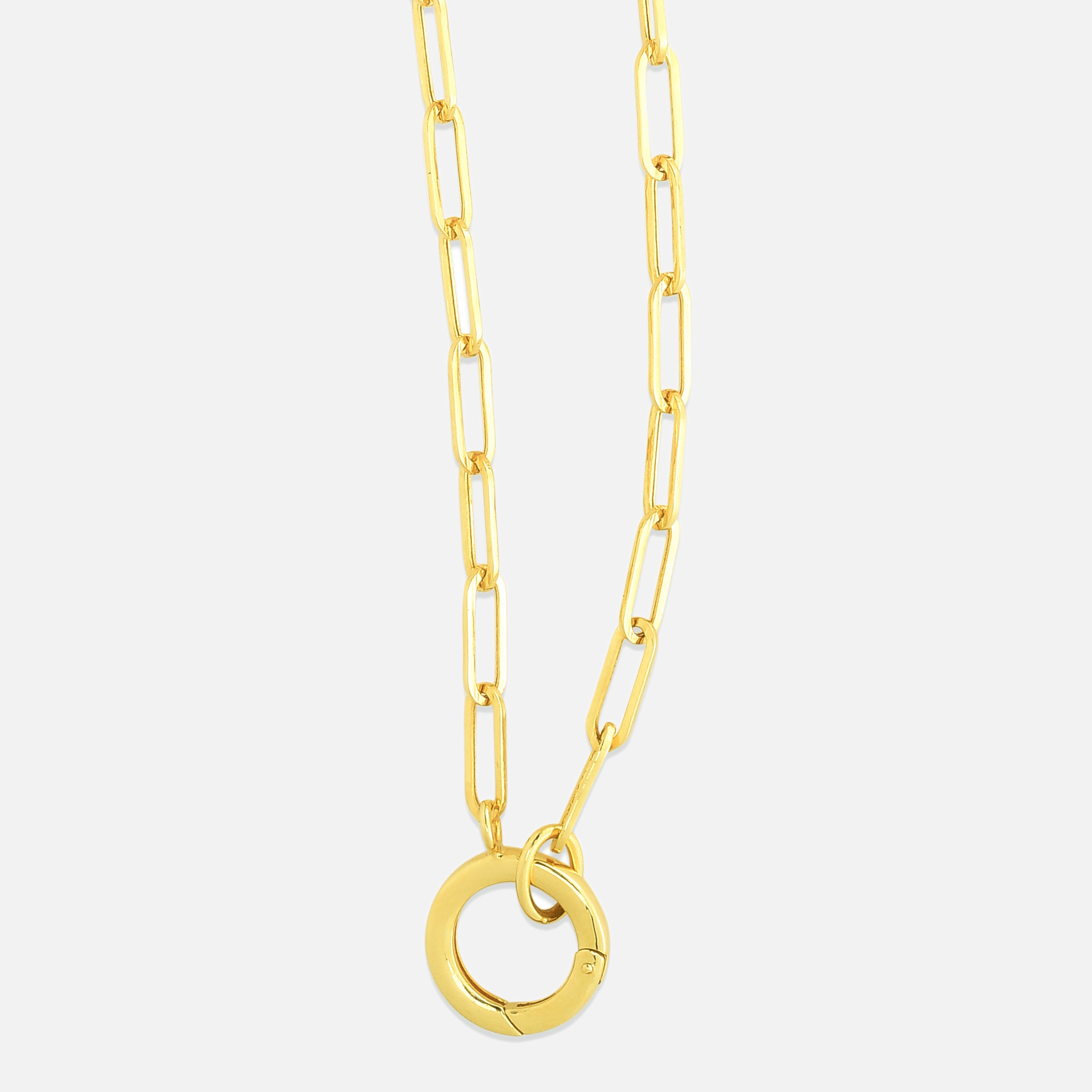 This paperclip charm necklace features a round, front-facing clasp charm that can be worn on its own or used as a link to layer your favorite charms together.