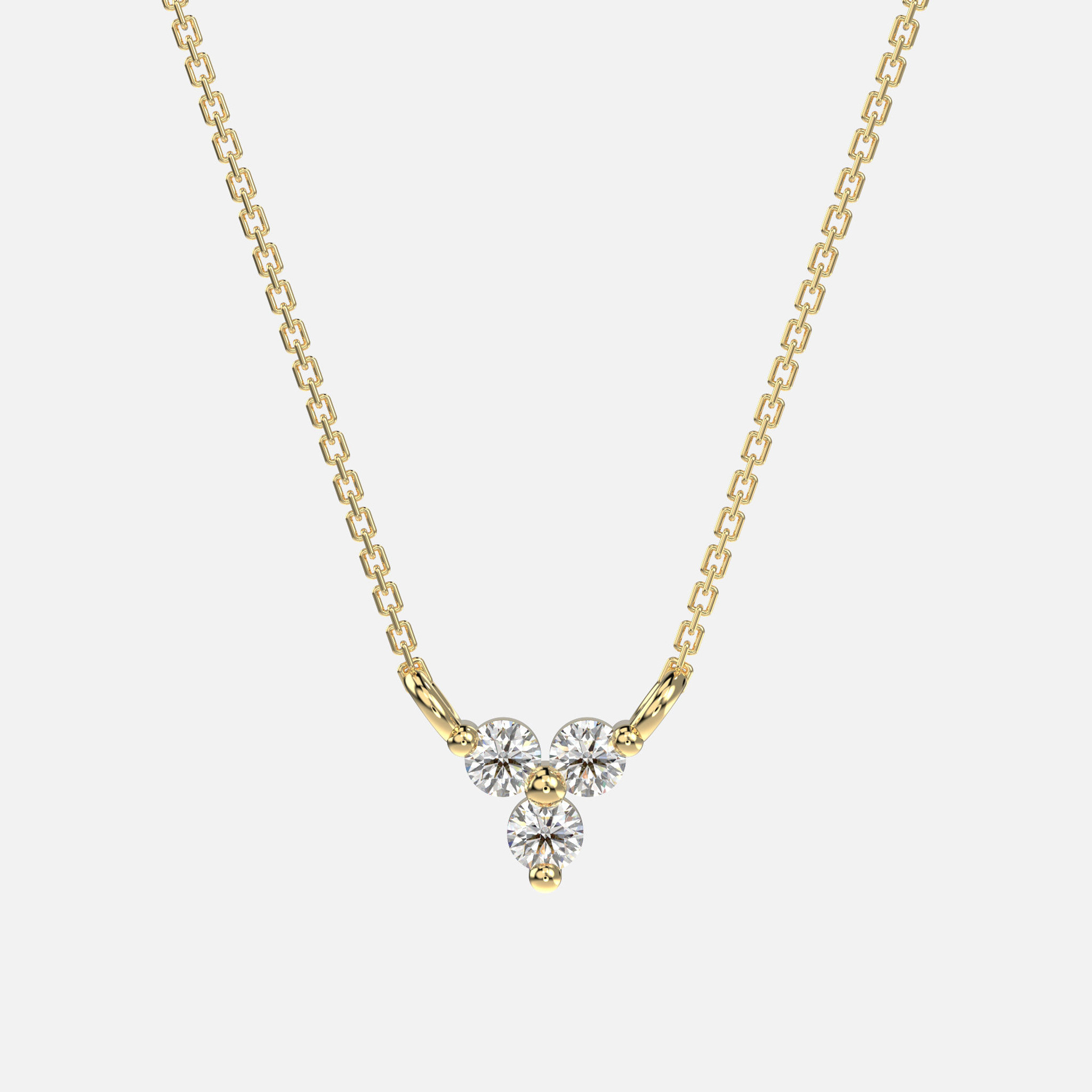 14k yellow gold diamond trio necklace. Anchored by .13 CTW round-prong diamond triad on fine cable chain.