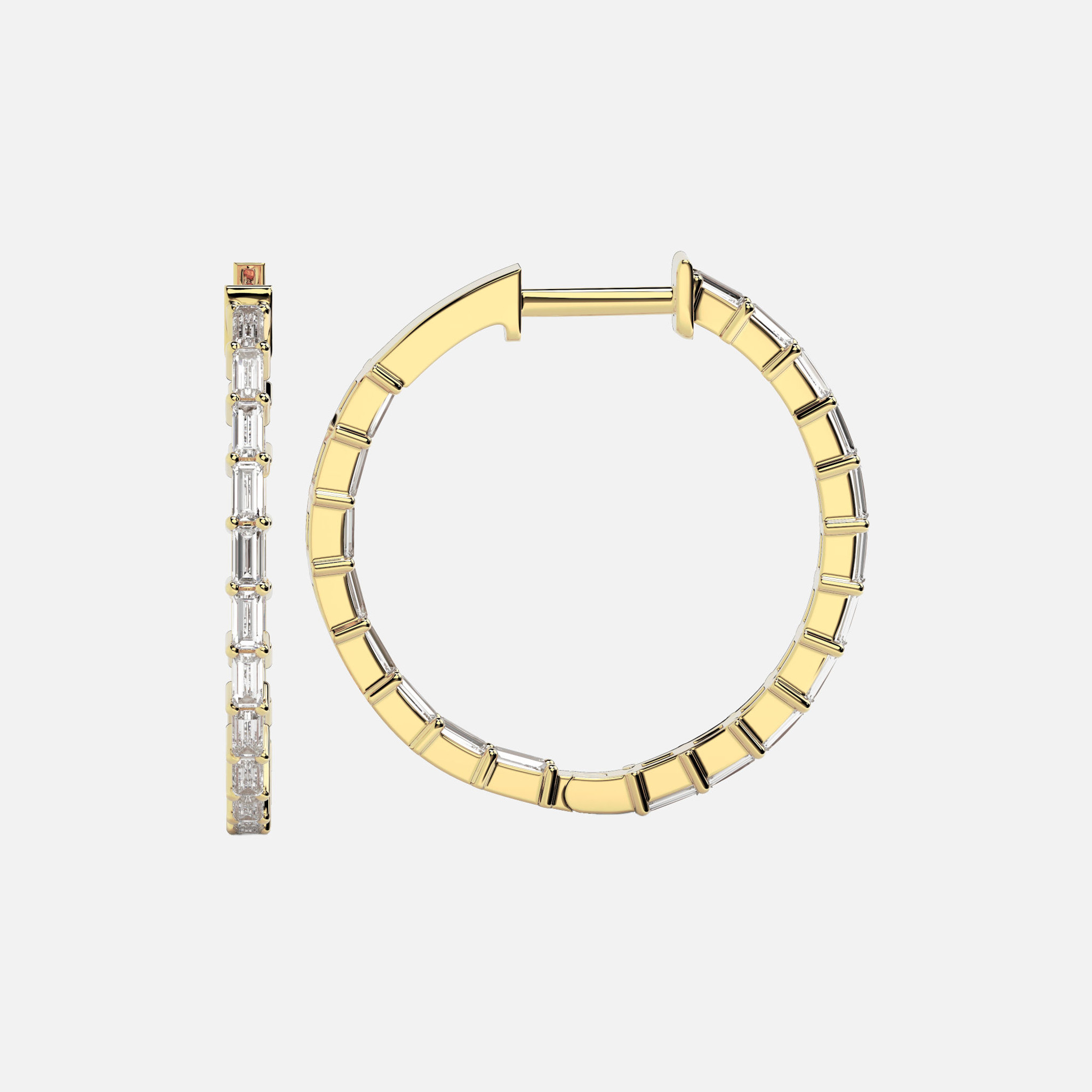 Inside Out Diamond Hoop Earrings: Handcrafted in 18k gold with dainty baguette cut diamonds set on the inside of the hoop, creating a captivating play of light with every head turn.