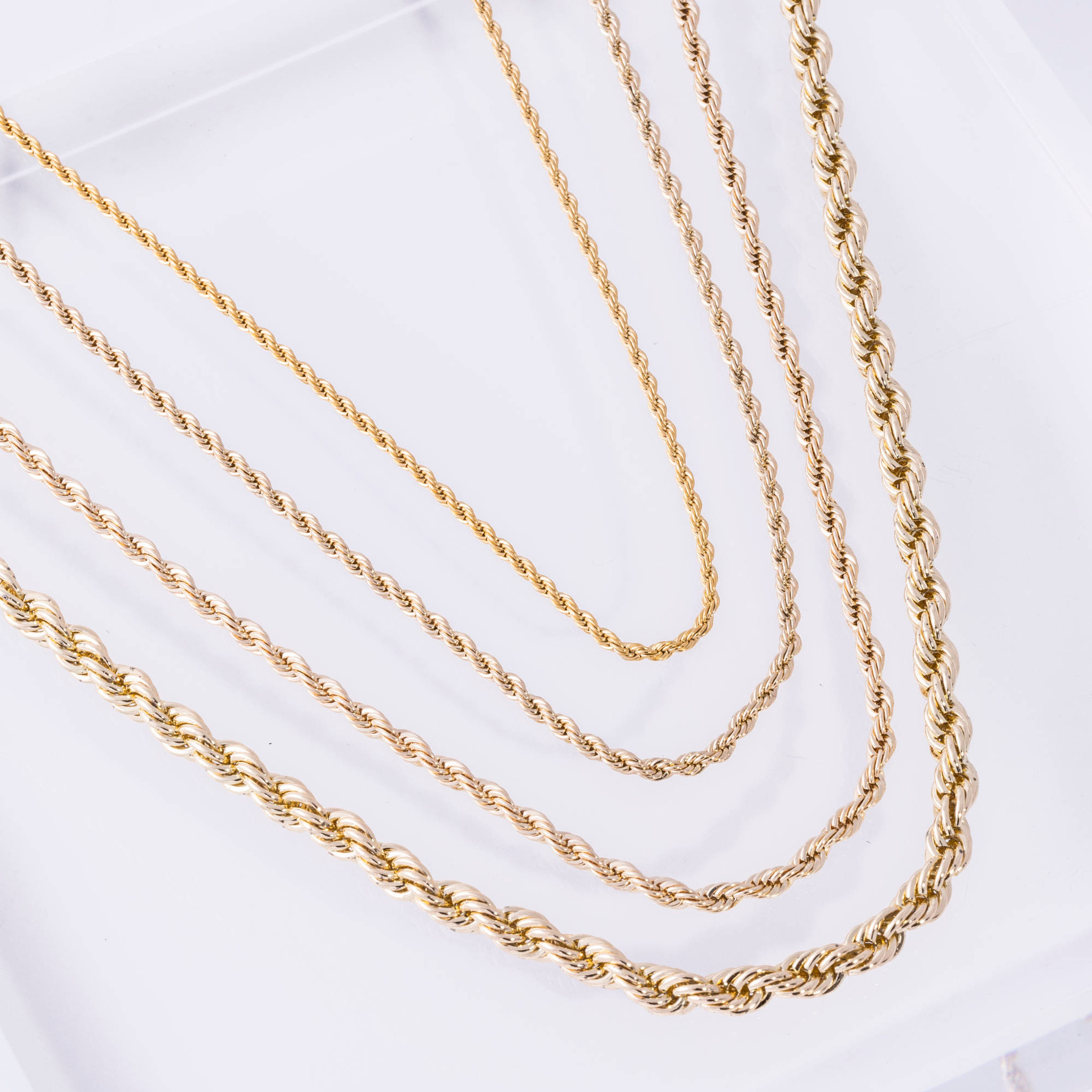 Presenting variations of the 10k gold rope chain, featuring textured diamond-cut links that capture intricate grooves.