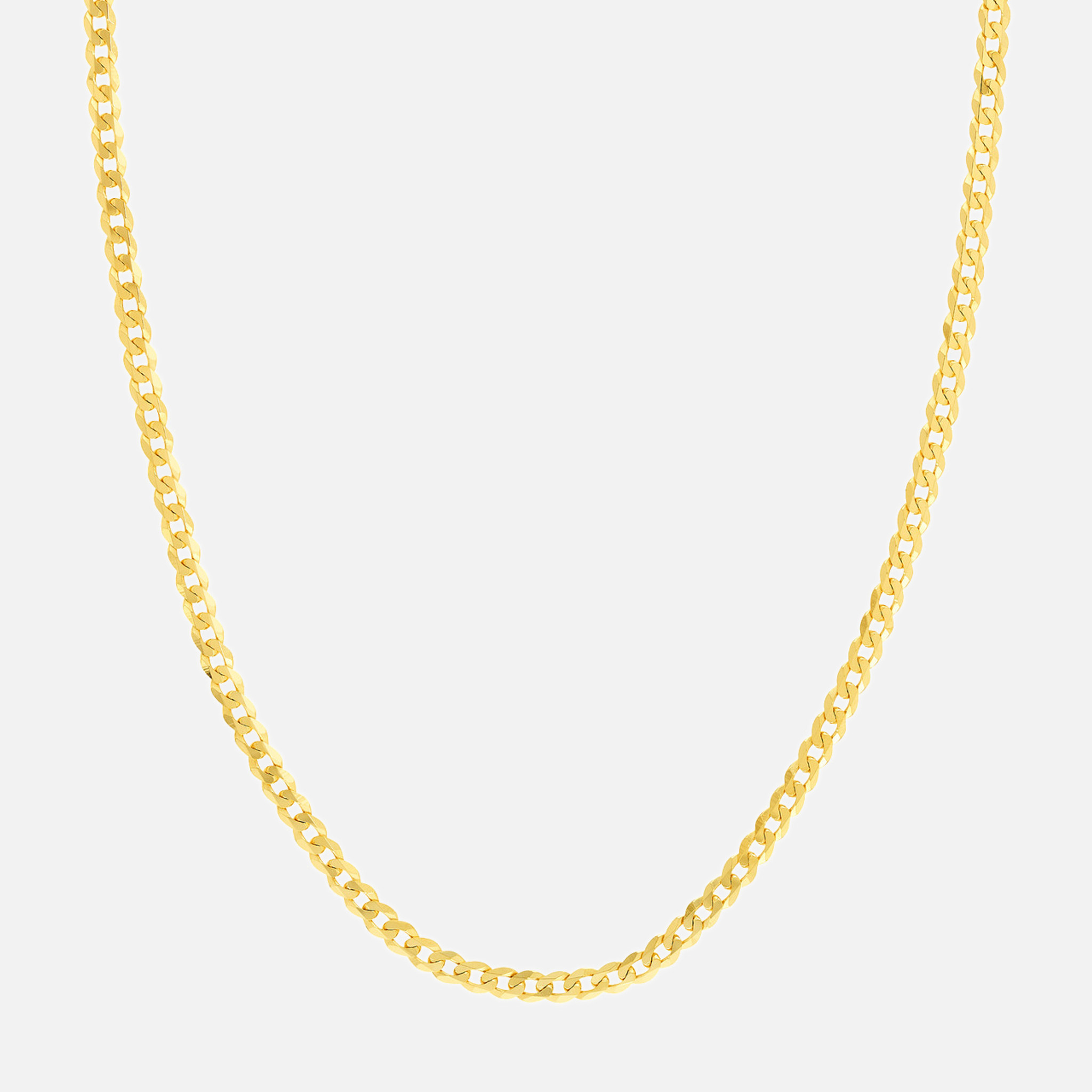 Elegant display of the gold curb chain anklet, crafted with timeless beauty in buttery 10k & 14k gold, featuring shiny 2.6mm chain links and a comfortable lobster clasp fastening.
