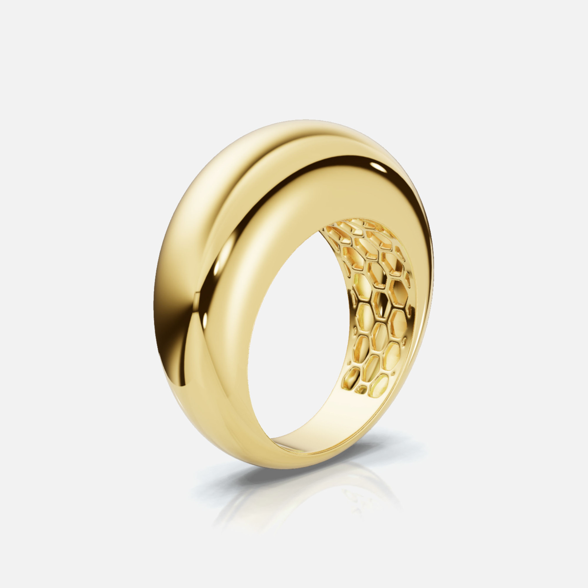 A side view of our yellow gold Dome Ring, boasting a substantial 7mm front for a stylish and sophisticated look, with hexagonal details inside.