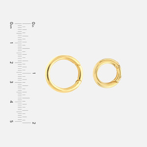 These round push lock connector charms are made of 14k yellow gold.