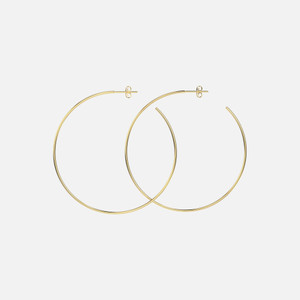 These post hoop earrings are crafted in polished 14k gold, boasting a sizable yet lightweight hoop design that sparkles effortlessly.