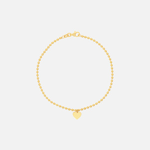 Pulsera de cadena de cuentas de oro de 14k, con una delicada silueta y un charm de corazón pulido, una pequeña delicia para llenar tu corazón.