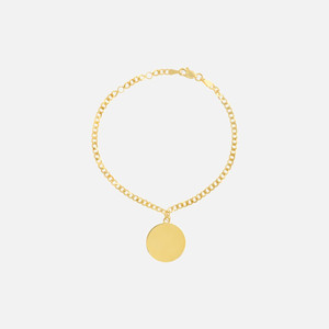 This coin charm bracelet is handcrafted in striking 14k gold. Features a customizable charm pendant that allows you to engrave.