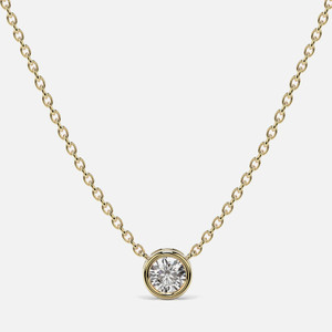 A solitaire diamond necklace on 18k gold cable chain, featuring a bezel-set brilliant-cut diamond, radiating feminine elegance.