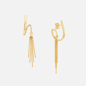 Gold tassel earrings hanging, showcasing timeless allure and contemporary sophistication.