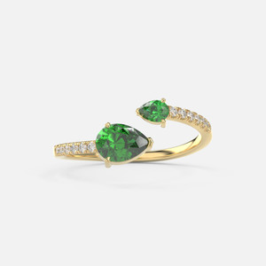 A front view of our 14k Gold Diamond Emerald Ring—marrying modern and classic styles, it features a unique pear-cut emerald and accent diamonds (0.10ct).